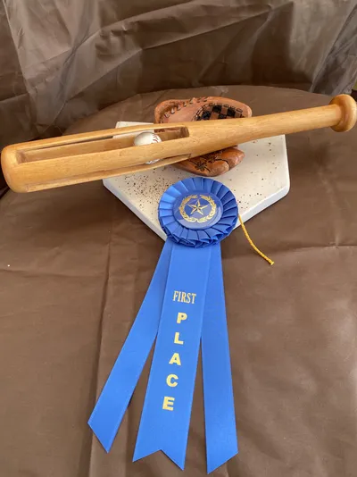 “Play Ball” Traditional ball in cage with a base ball bat and glove